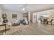 Bright, open-concept living area with tile floors and views into the dining and kitchen at 5808 E Brown Rd # 49, Mesa, AZ 85205
