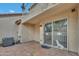 Private patio with AC unit, tiled floor, security door, and gate at 5808 E Brown Rd # 49, Mesa, AZ 85205