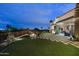 Expansive backyard featuring a modern outdoor living space with a cozy fire pit and city views at 6102 E Sage Dr, Paradise Valley, AZ 85253