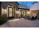 Picturesque front entrance featuring stone accents, an ornate iron gate, and a cozy courtyard at 6102 E Sage Dr, Paradise Valley, AZ 85253