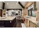 Gourmet kitchen featuring custom cabinets, granite countertops, and expansive island with seating at 6102 E Sage Dr, Paradise Valley, AZ 85253