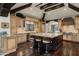 Gourmet kitchen featuring custom cabinets, granite countertops, large island, and professional-grade appliances at 6102 E Sage Dr, Paradise Valley, AZ 85253