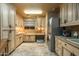 Bright laundry room with custom cabinets, modern washer and dryer, and a cozy dog bed at 6102 E Sage Dr, Paradise Valley, AZ 85253