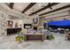 Open-concept living area with a bar, fireplace, comfortable seating, and panoramic views at 6102 E Sage Dr, Paradise Valley, AZ 85253