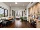 Bright sitting area with hardwood floors, built-in desk, and large windows providing ample natural light at 6102 E Sage Dr, Paradise Valley, AZ 85253