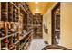 Climate-controlled wine cellar with extensive racking, tile floor, and capacity for a vast collection of bottles at 6102 E Sage Dr, Paradise Valley, AZ 85253