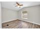 Bright bedroom with vinyl flooring and a ceiling fan at 6921 W Wanda Lynn Ln, Peoria, AZ 85382