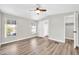 Inviting bedroom with wood-look flooring, ensuite bath, and closet at 6921 W Wanda Lynn Ln, Peoria, AZ 85382