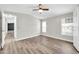 Open bedroom boasts ample natural light, new flooring and a ceiling fan at 6921 W Wanda Lynn Ln, Peoria, AZ 85382