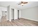Bedroom with wood-look flooring, ceiling fan and closet space at 6921 W Wanda Lynn Ln, Peoria, AZ 85382
