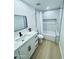Modern bathroom with white cabinetry, sleek fixtures, and a stylish tiled shower and bathtub combination at 727 W Maryland Ave # 1, Phoenix, AZ 85013