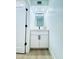 Elegant powder room featuring a modern vanity, stylish mirror, and contemporary finishes at 727 W Maryland Ave # 1, Phoenix, AZ 85013