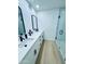 Contemporary bathroom featuring dual sinks, black fixtures, and sleek shower at 727 W Maryland Ave # 1, Phoenix, AZ 85013