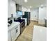 Contemporary kitchen equipped with stainless steel appliances, sleek countertops, and ample storage space at 727 W Maryland Ave # 1, Phoenix, AZ 85013