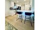 Modern kitchen features a breakfast bar, stainless steel appliances, and ample countertop space at 727 W Maryland Ave # 1, Phoenix, AZ 85013