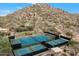 Aerial view of several tennis and pickle ball courts in a desert mountain setting at 7291 E Eagle Feather Rd, Scottsdale, AZ 85266