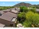 Aerial view of home with lush backyard and mountain views at 7291 E Eagle Feather Rd, Scottsdale, AZ 85266