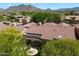 Aerial view of home with backyard, lush landscaping and community view at 7291 E Eagle Feather Rd, Scottsdale, AZ 85266