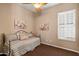 Bedroom featuring neutral walls, a daybed and window with white shutters at 7291 E Eagle Feather Rd, Scottsdale, AZ 85266