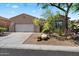 Charming single-story home featuring desert landscaping and a two-car garage at 7291 E Eagle Feather Rd, Scottsdale, AZ 85266
