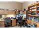 Home office with built-in cabinets and desk areas, offering a functional and organized workspace at 7291 E Eagle Feather Rd, Scottsdale, AZ 85266