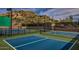 Close up view of a blue and green well-maintained pickleball court at 7291 E Eagle Feather Rd, Scottsdale, AZ 85266