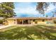 Well-maintained backyard with a covered patio, barbecue, lush lawn, and comfortable seating for outdoor relaxation at 7307 N 17Th Ave, Phoenix, AZ 85021
