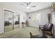 Cozy bedroom featuring a ceiling fan, vintage decor, closet with mirror doors, and plush carpeting at 7307 N 17Th Ave, Phoenix, AZ 85021