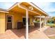 Charming covered patio with tile flooring, a dining area, and a built-in bar, perfect for outdoor entertaining at 7307 N 17Th Ave, Phoenix, AZ 85021