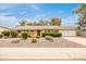 Charming single-story home featuring a well-manicured front yard and a two-car garage at 7307 N 17Th Ave, Phoenix, AZ 85021