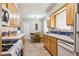Bright kitchen featuring wood cabinetry, a dining table, and tile countertops at 7307 N 17Th Ave, Phoenix, AZ 85021
