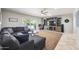 Cozy living room featuring a comfortable sectional sofa, media center, and access to the backyard pool at 7307 N 17Th Ave, Phoenix, AZ 85021