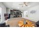 Bright and airy living room featuring a media center, ceiling fan, and an inviting atmosphere at 7307 N 17Th Ave, Phoenix, AZ 85021