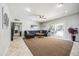 Spacious living room with stylish furniture, a large rug, and sliding glass doors leading to the outdoor area at 7307 N 17Th Ave, Phoenix, AZ 85021
