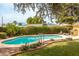 Backyard pool area with lounge chairs, lush greenery, and a private setting perfect for relaxation at 7307 N 17Th Ave, Phoenix, AZ 85021