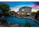 Inviting backyard featuring a sparkling pool, lush landscaping, and a covered patio for ultimate relaxation and entertainment at 7342 E Norwood St, Mesa, AZ 85207