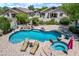 Backyard featuring a pebble tec pool with waterfall, tanning deck, and spa at 7342 E Norwood St, Mesa, AZ 85207
