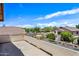 This balcony overlooks mature desert landscaping and nearby homes at 7342 E Norwood St, Mesa, AZ 85207
