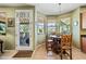 Bright breakfast nook featuring natural light, a decorative light fixture, and a door to outdoor at 7342 E Norwood St, Mesa, AZ 85207