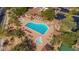 Aerial view of a community pool with lap lanes, spa, covered seating, and desert landscaping at 7342 E Norwood St, Mesa, AZ 85207