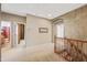 Upstairs hallway with wood railing leading to bathroom, bedroom and walk in closet at 7342 E Norwood St, Mesa, AZ 85207