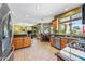 Open kitchen showcasing natural light, stainless steel appliances, and views of dining and living areas at 7342 E Norwood St, Mesa, AZ 85207