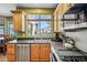 Well-equipped kitchen with stainless steel appliances and a view of the backyard pool at 7342 E Norwood St, Mesa, AZ 85207