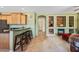 Open-concept kitchen and living area with breakfast bar, fireplace, and built-in display shelves at 7342 E Norwood St, Mesa, AZ 85207