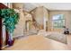 Bright living room features high ceilings, lots of natural light, and a staircase at 7342 E Norwood St, Mesa, AZ 85207