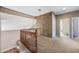 Carpeted loft area with view of staircase and entry to additional rooms at 7342 E Norwood St, Mesa, AZ 85207