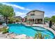 Backyard view of a stunning pool and patio with an outdoor seating area, perfect for entertaining at 7342 E Norwood St, Mesa, AZ 85207