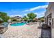 Backyard featuring a sparkling pool and spa, perfect for relaxing and entertaining on a sunny day at 7342 E Norwood St, Mesa, AZ 85207