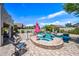 Backyard featuring a sparkling pool and spa, perfect for relaxing and entertaining on a sunny day at 7342 E Norwood St, Mesa, AZ 85207