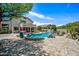 Backyard view of a stunning pool and patio with an outdoor seating area, perfect for entertaining at 7342 E Norwood St, Mesa, AZ 85207